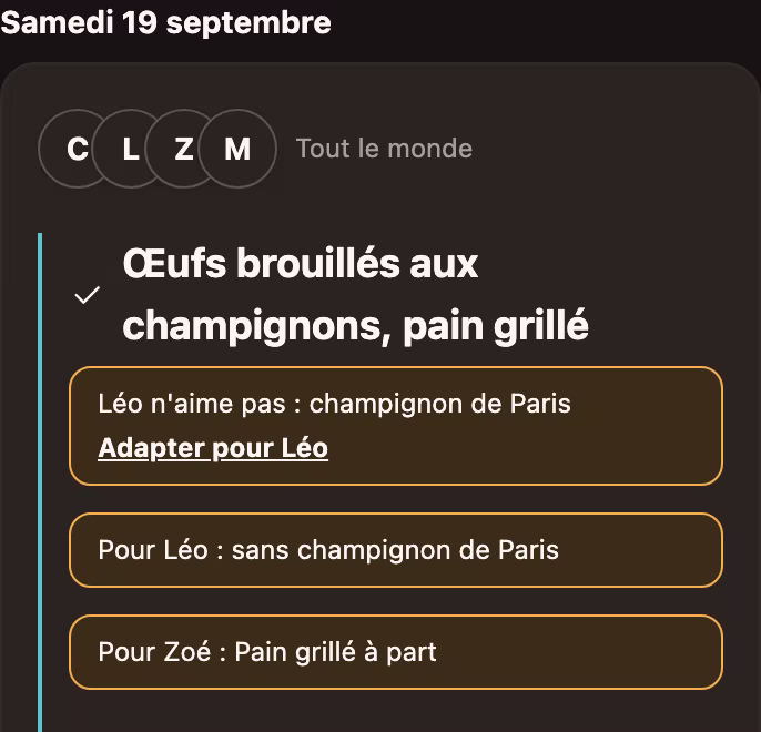 La même carte une fois validée : « Pour Léo : sans champignon de Paris » et « Pour Zoé : pain grillé à part », deux versions d'un seul plat.